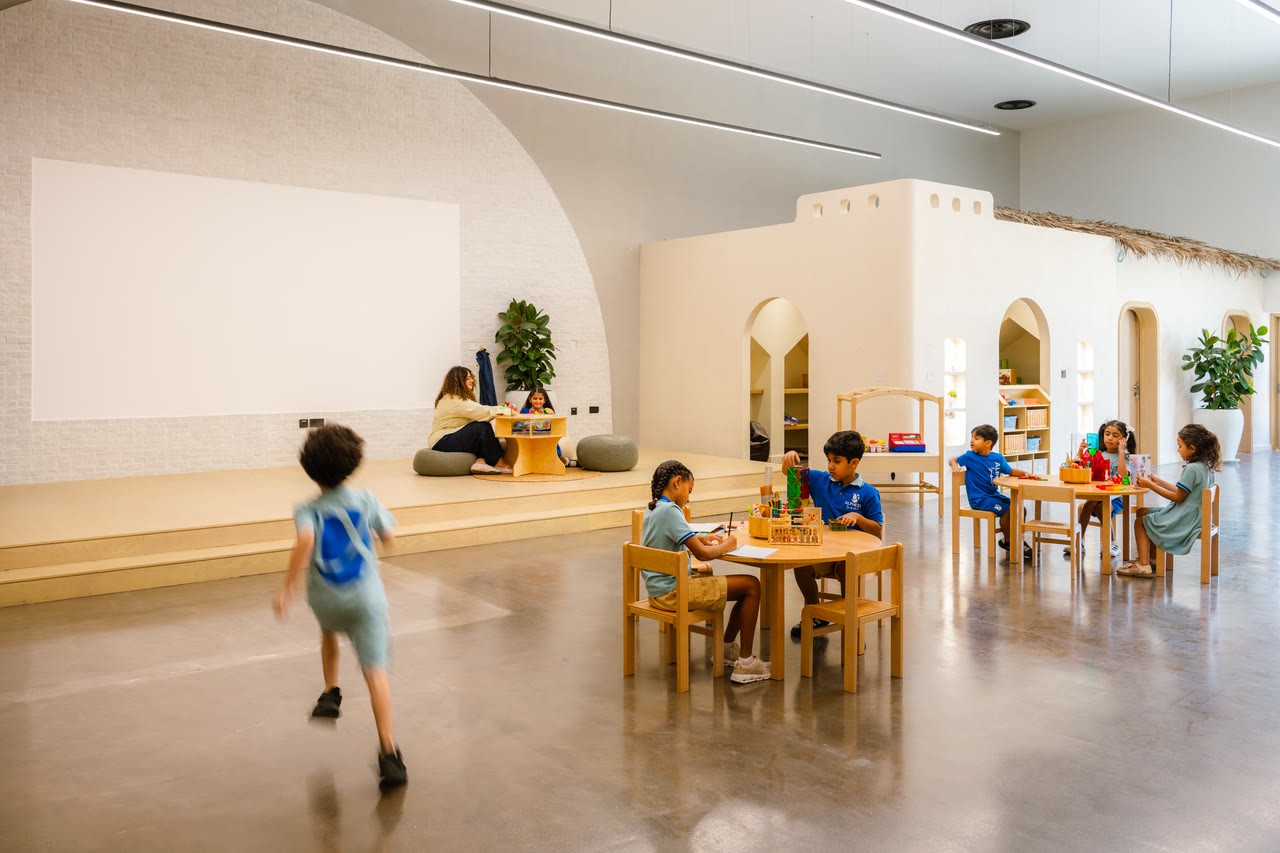 Learners choose activities in a bright, open Alphera learning space.